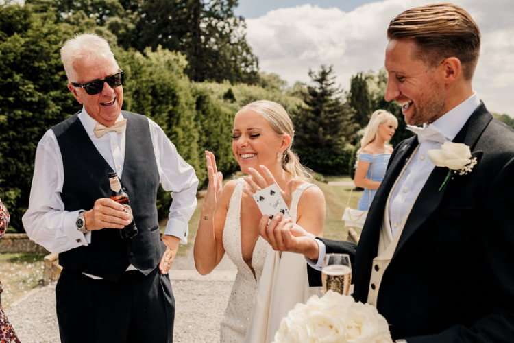 Richard Parsons the Gloucestershire Magician performing tricks for newlyweds Daisy and Chris at De Vere Tortworth Court