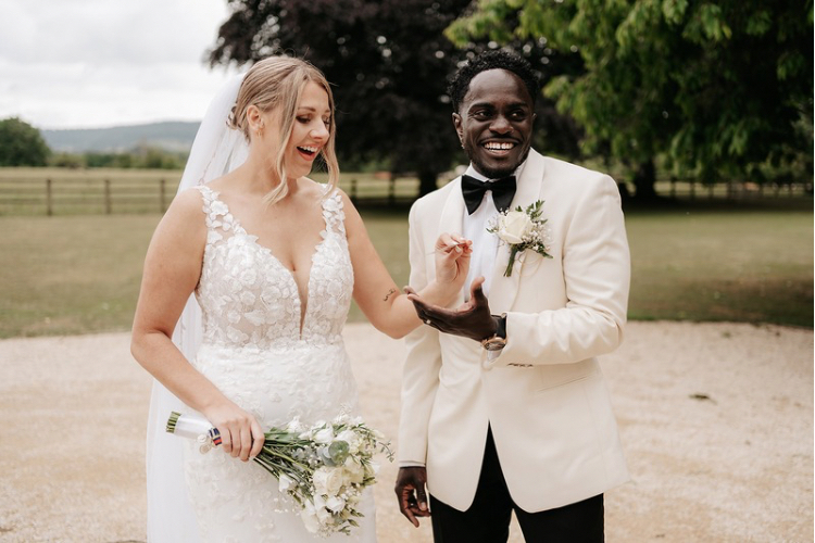 Bride and Groom enjoying magic card tricks at Eastingon Park wedding Venue